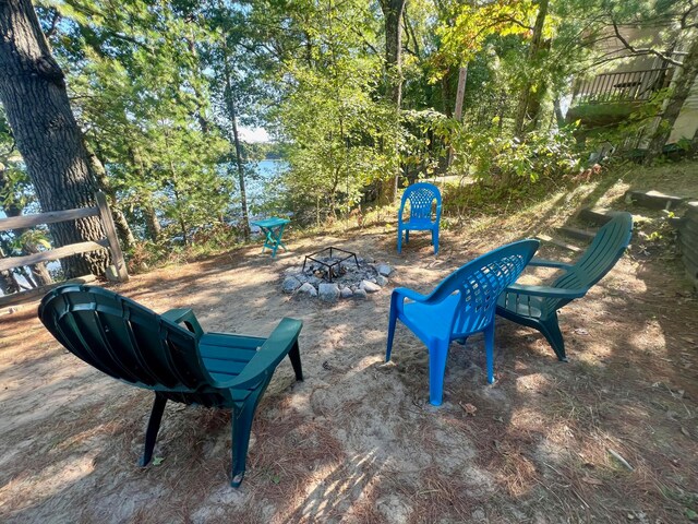 view of home's community featuring a fire pit