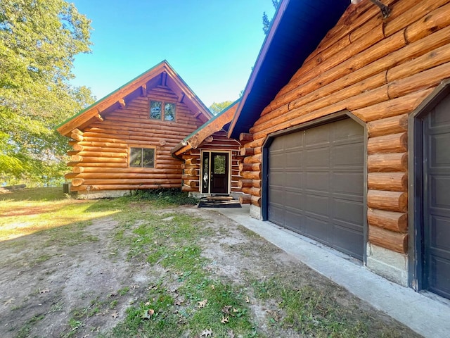 log home with a garage