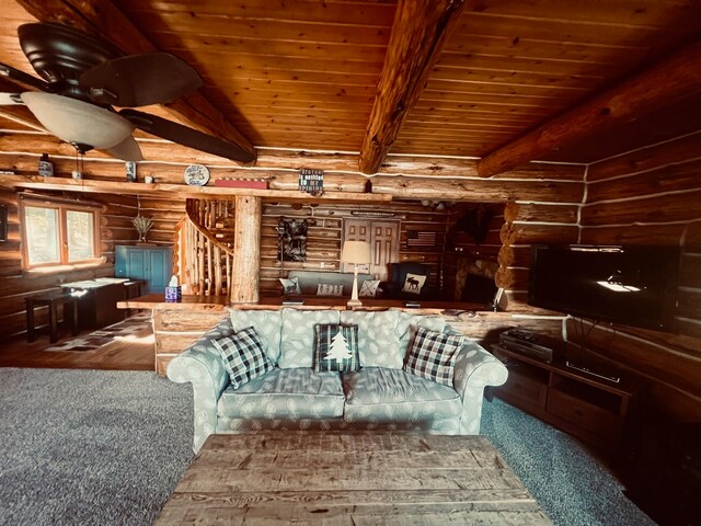 living room featuring beamed ceiling, wooden ceiling, hardwood / wood-style flooring, and log walls