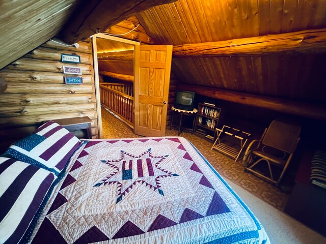 bedroom featuring log walls, vaulted ceiling, and wood ceiling