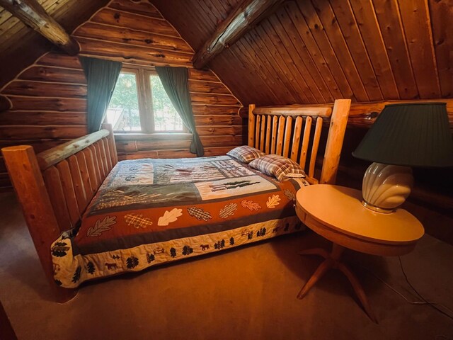 bedroom featuring lofted ceiling with beams, wood ceiling, and log walls