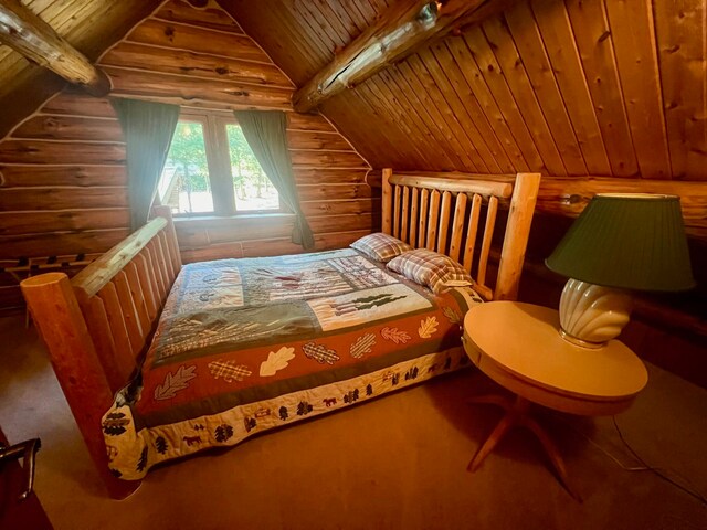 bedroom featuring lofted ceiling with beams and wood ceiling