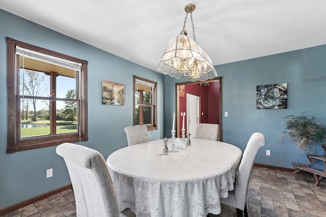 dining area with a notable chandelier