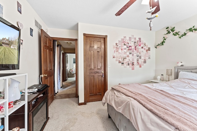 bedroom with light colored carpet and ceiling fan