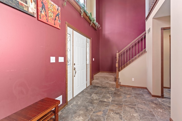 entrance foyer featuring a high ceiling