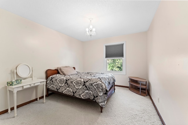 carpeted bedroom with a notable chandelier