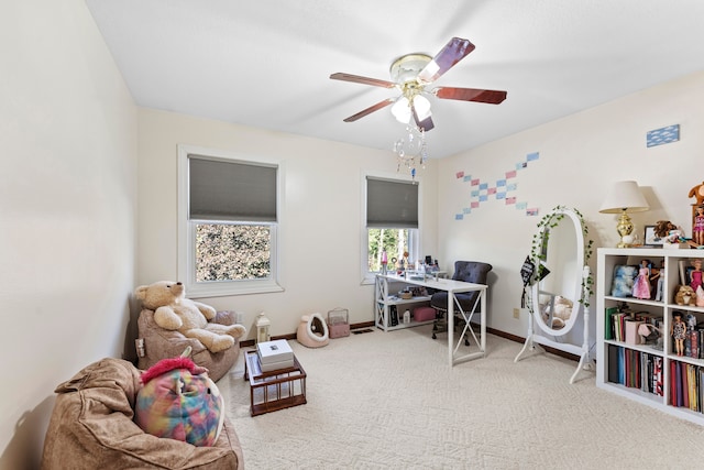 office area featuring ceiling fan and light carpet