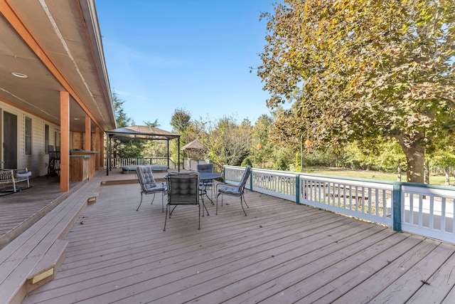 wooden deck with a gazebo