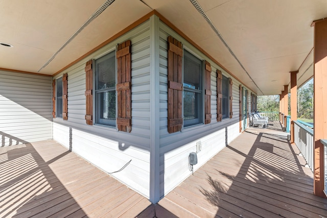 wooden terrace featuring a porch