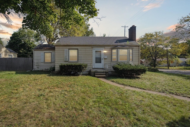 view of front of house with a lawn