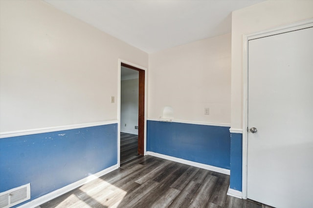 empty room featuring dark hardwood / wood-style floors