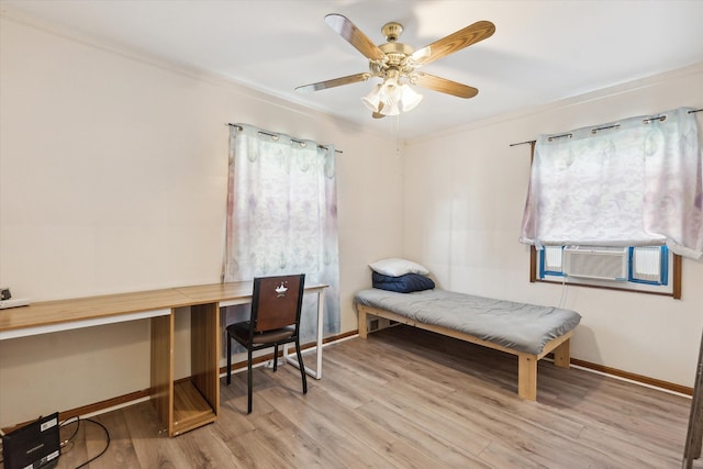 bedroom featuring ceiling fan, light hardwood / wood-style flooring, cooling unit, and ornamental molding