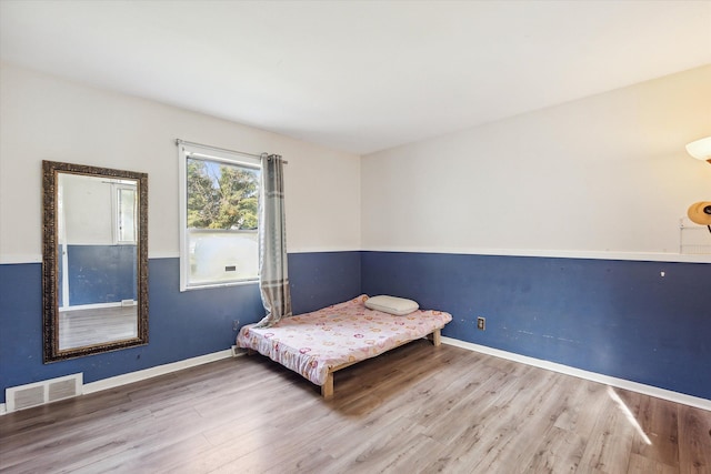 unfurnished bedroom with wood-type flooring