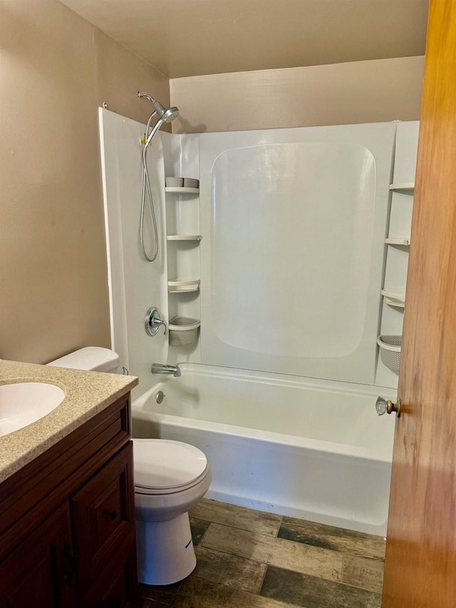 bathroom with vanity, shower / tub combination, toilet, and wood finished floors