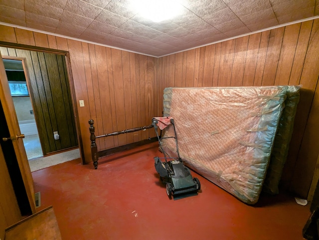 interior space with carpet and wood walls