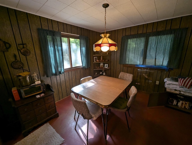 dining area with wood walls