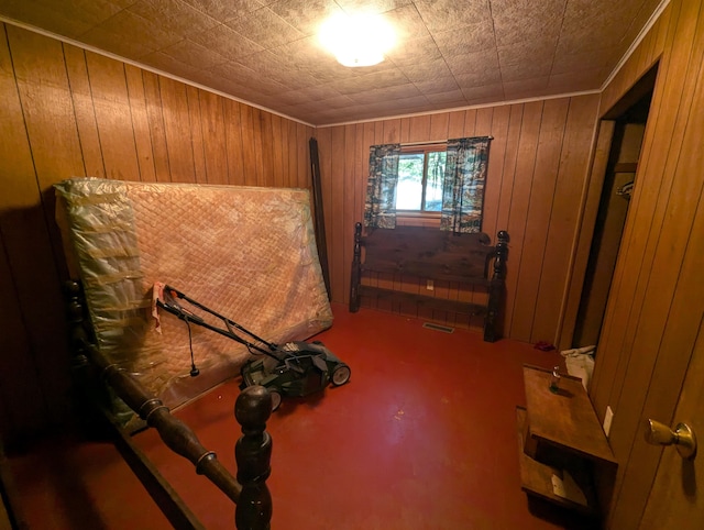 miscellaneous room featuring carpet floors and wooden walls