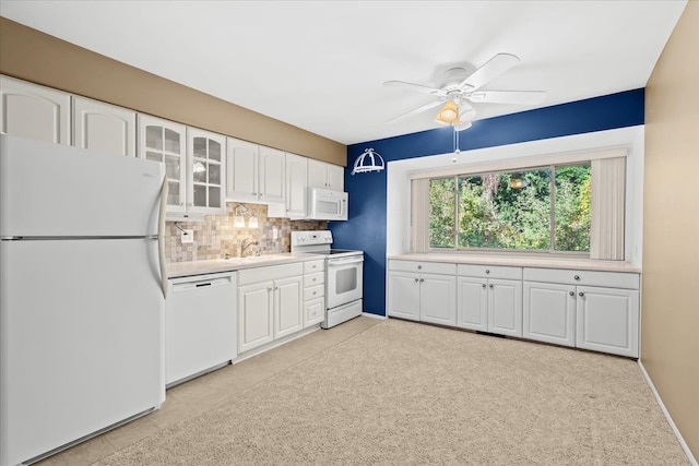 kitchen featuring backsplash, white appliances, ceiling fan, light tile patterned floors, and white cabinetry