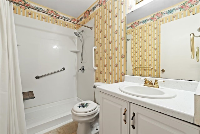 bathroom featuring tile patterned flooring, vanity, toilet, and walk in shower