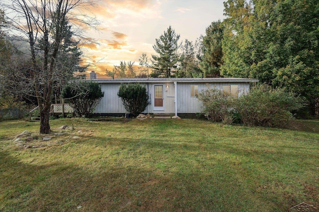 view of front of home with a lawn