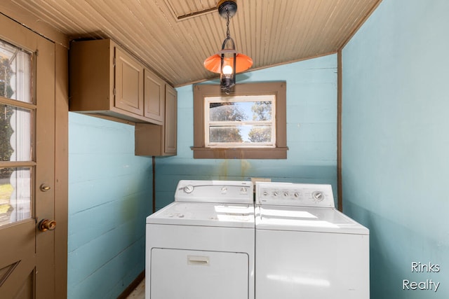 laundry area featuring cabinets, washing machine and dryer, and wood ceiling