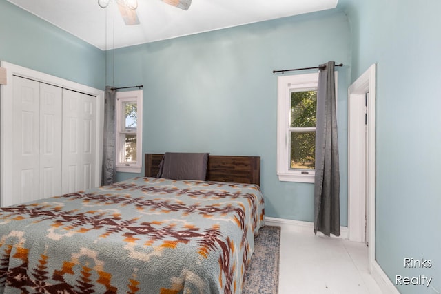 bedroom with ceiling fan and a closet