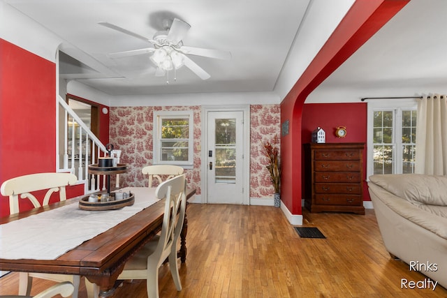 dining area featuring ceiling fan, hardwood / wood-style floors, and a healthy amount of sunlight