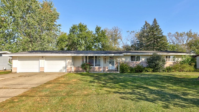 single story home featuring a front lawn and a garage