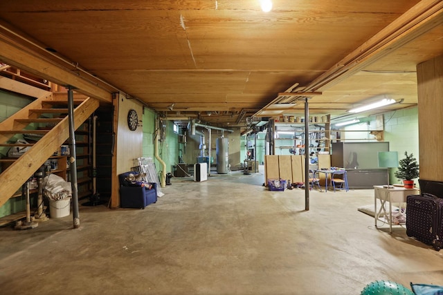 basement with water heater and wood ceiling