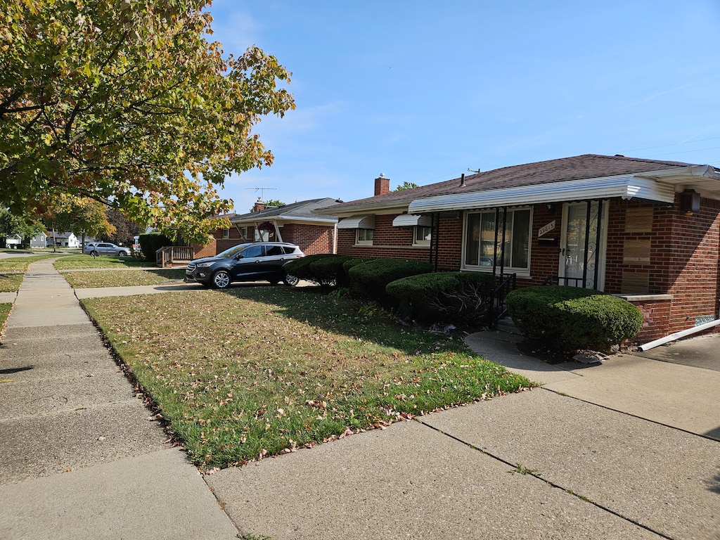 view of home's exterior featuring a yard