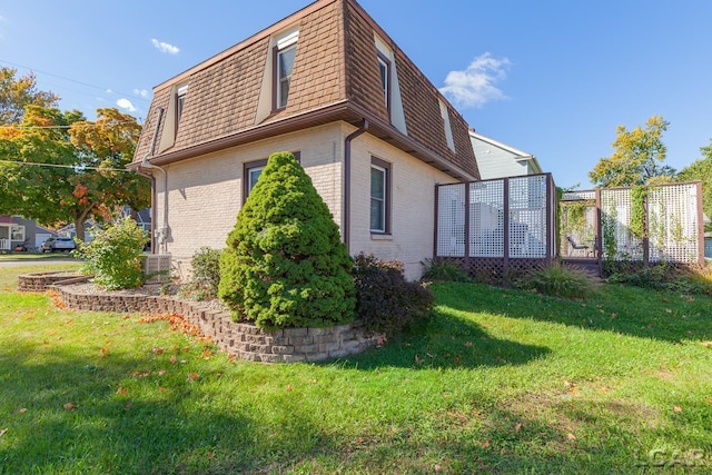 view of property exterior with a yard