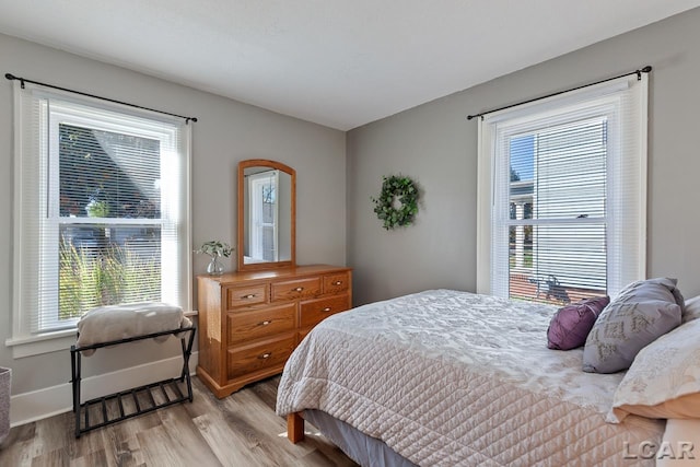 bedroom with light hardwood / wood-style flooring