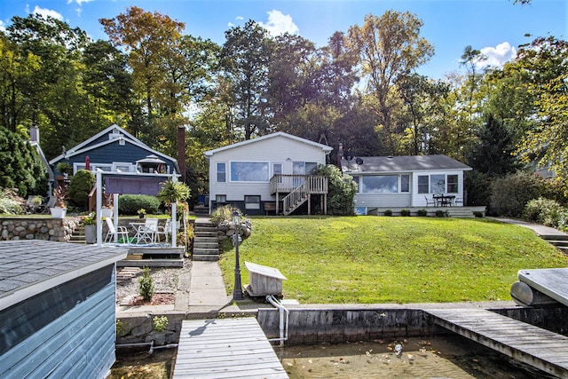 dock area with a yard and a wooden deck