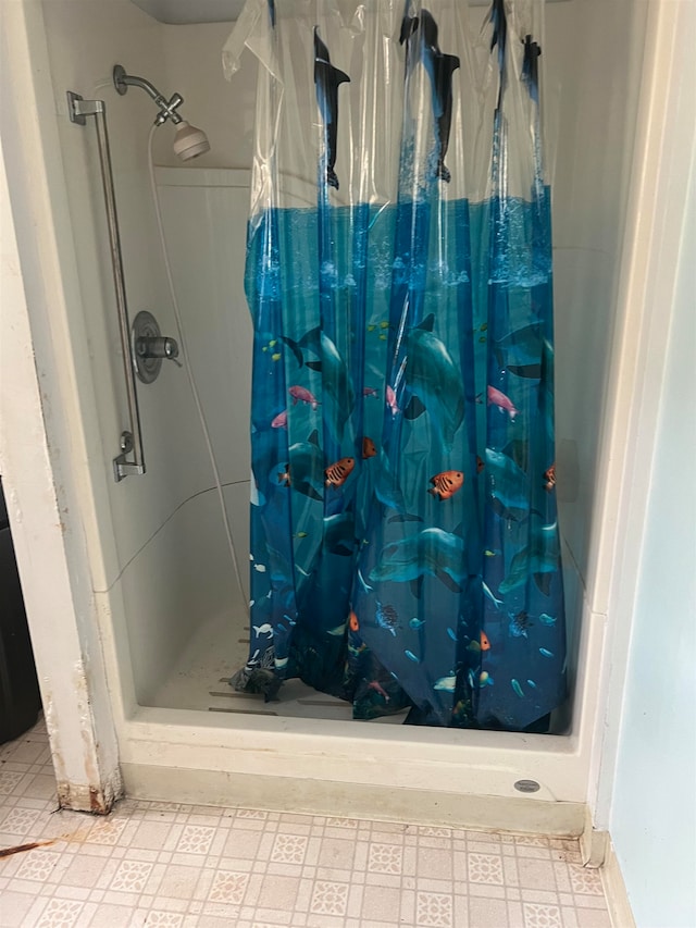 bathroom with a shower with shower curtain