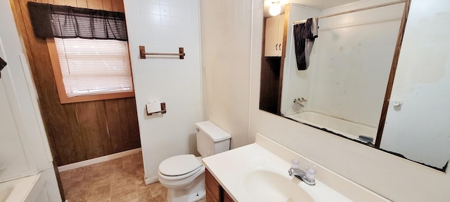 full bathroom with shower / bath combo, vanity, and toilet