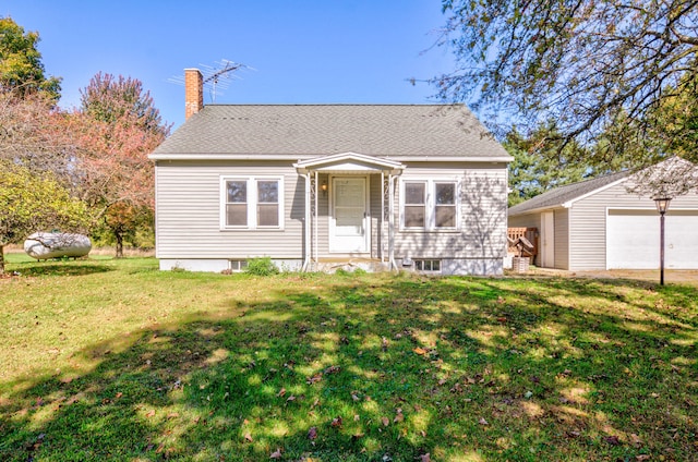 view of front of house with a front lawn and a garage