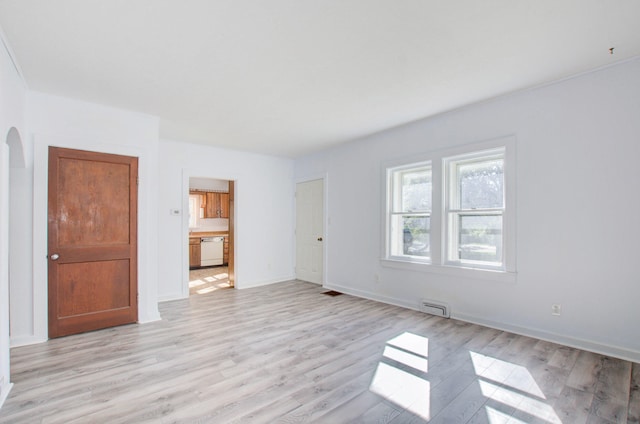 unfurnished room featuring light hardwood / wood-style floors