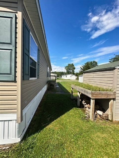 view of home's exterior featuring a yard