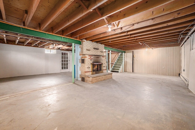 7080 Pine Island Dr NE, Comstock Park, MI 49321 - basement with baseboard heating and a brick fireplace