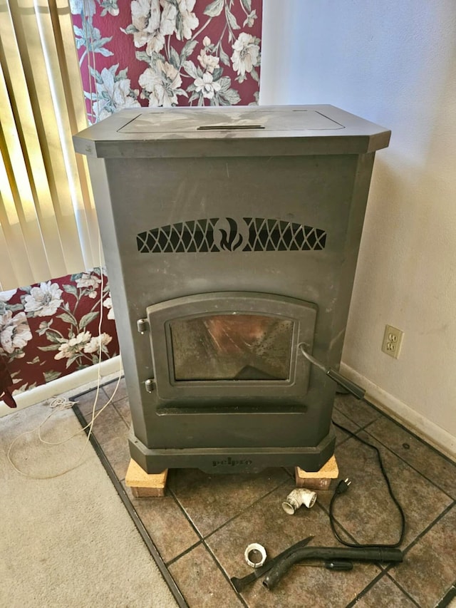 interior details with carpet flooring and a wood stove