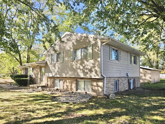 rear view of house with a yard