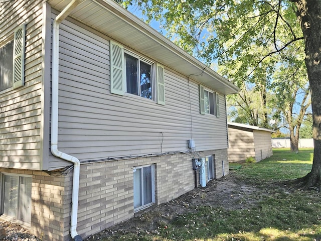 view of home's exterior with a yard