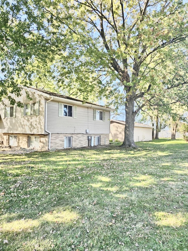 exterior space with a yard and central AC unit