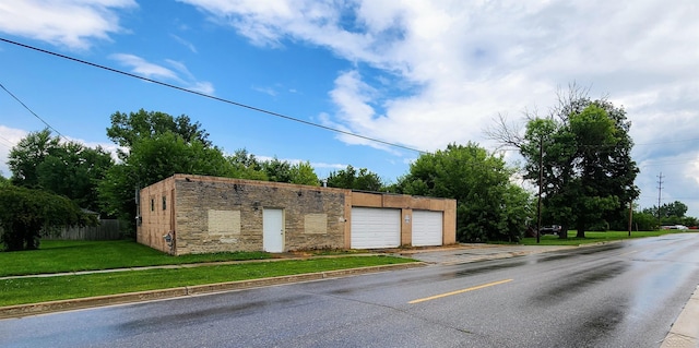 garage featuring a yard