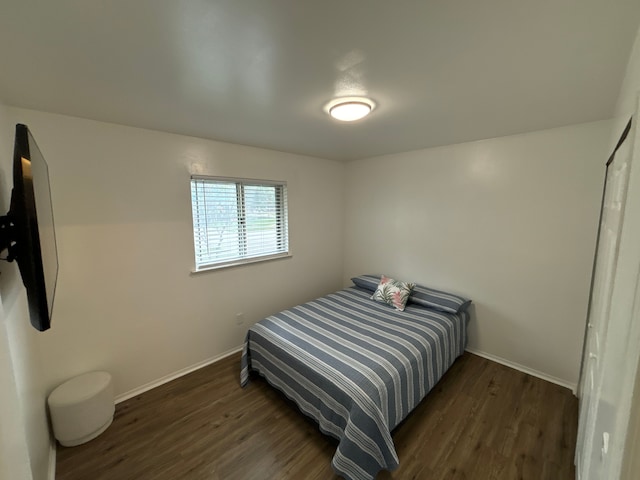 bedroom featuring dark hardwood / wood-style floors