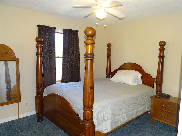 bedroom featuring ceiling fan, carpet floors, and a textured ceiling