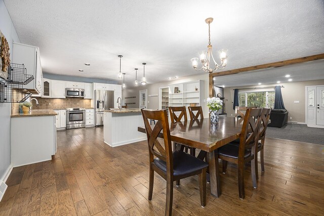 11600 Baker Rd, Greenville, MI 48838 - dining room with a chandelier, dark wood-style floors, baseboards, recessed lighting, and a textured ceiling