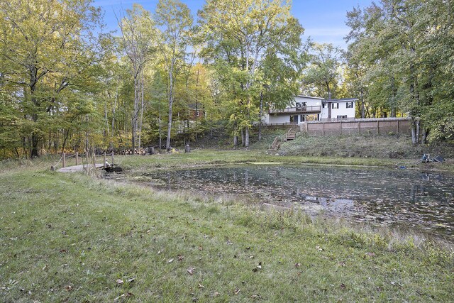 11600 Baker Rd, Greenville, MI 48838 - view of green lawn with a water view