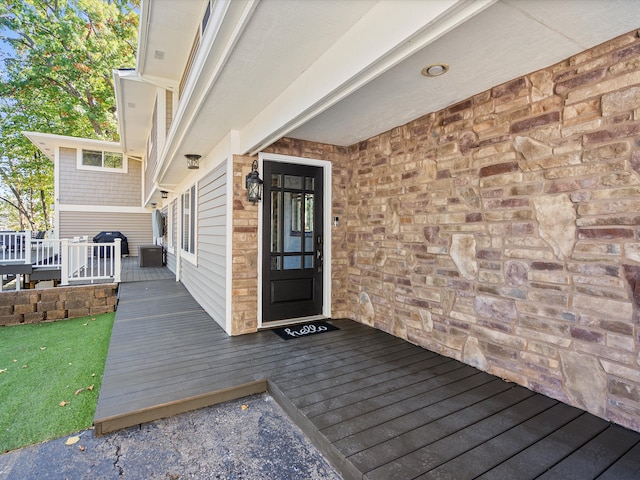 doorway to property with a deck