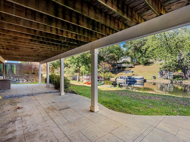 view of patio featuring a water view